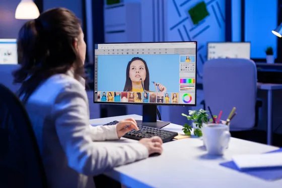 A designer retouching artwork with colour grading
